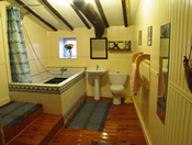 Kids love the huge bath, originally an old stone wine vat ! (click to enlarge photo)