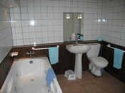 en-suite bathroom with spa bath