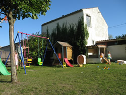 Toddler friendly Swings, Wendy house and large covered Sandpit
